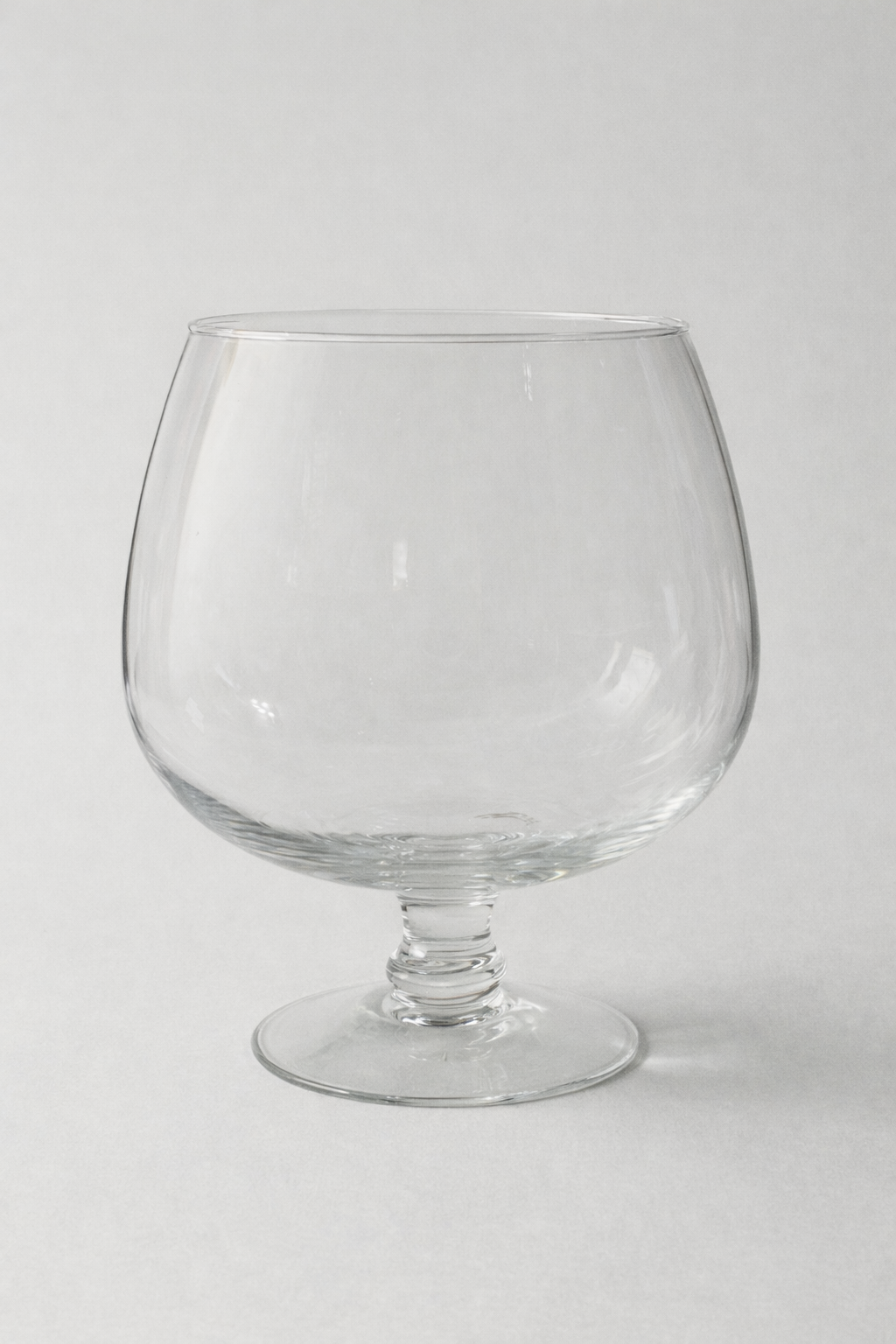 Clear Pedestal Vessel — Rounded Bowl Silhouette